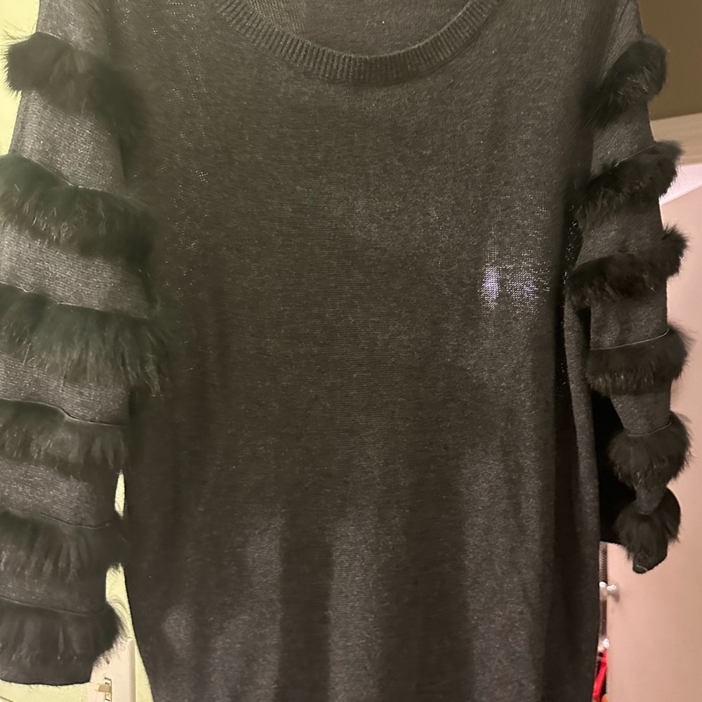 Beautiful black sweater with fur on sleeves